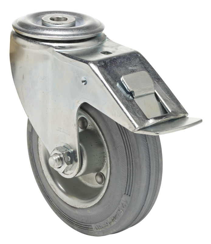 Swivel castor with total brake mounted behind